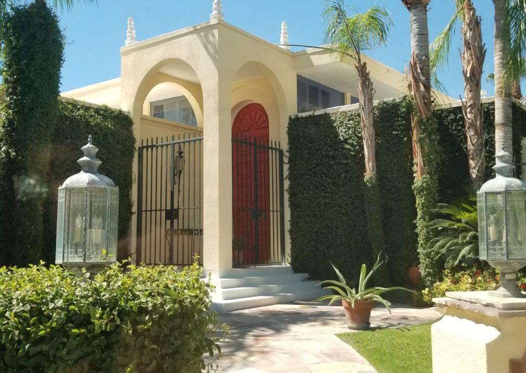 Rich and famous homes palm springs instagrammable red door