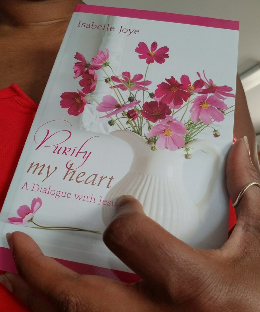 Purify My Heart book in black hands