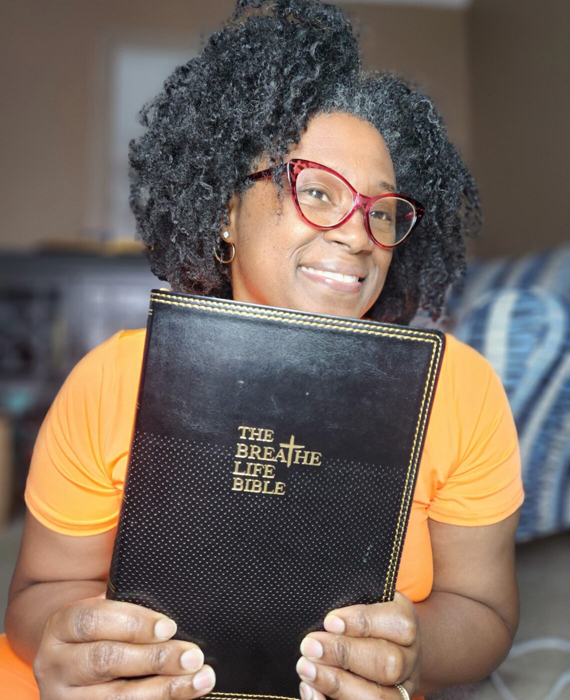 Female holding The Breathe Life Bible