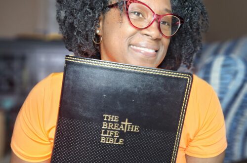 Female holding The Breathe Life Bible